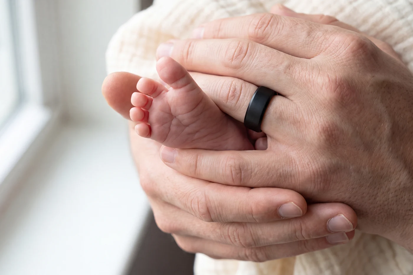 A family together at home, one of them wearing the ring