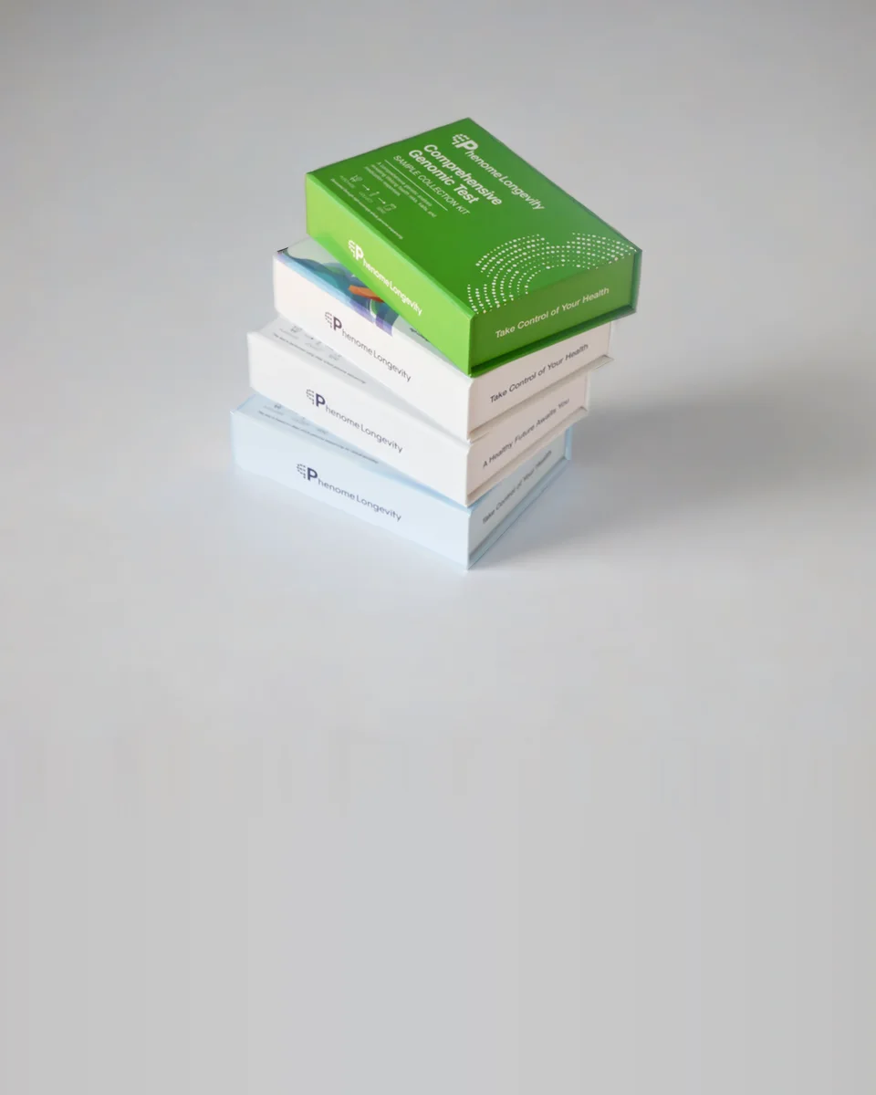 The Comprehensive Genomic Test kit, its green box on a stack of Phenome kits