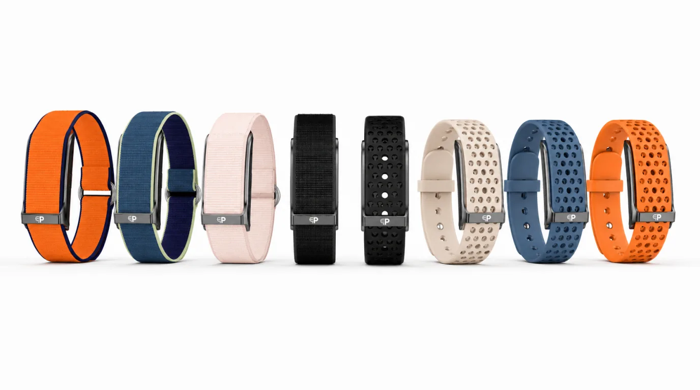 Five PhenomeTech Bands in an arc: Ember, Harbour, Onyx facing forward in the centre, Dune and Tidal woven